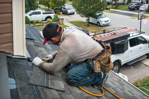 Professional Roofing technician working in Slickville, PA